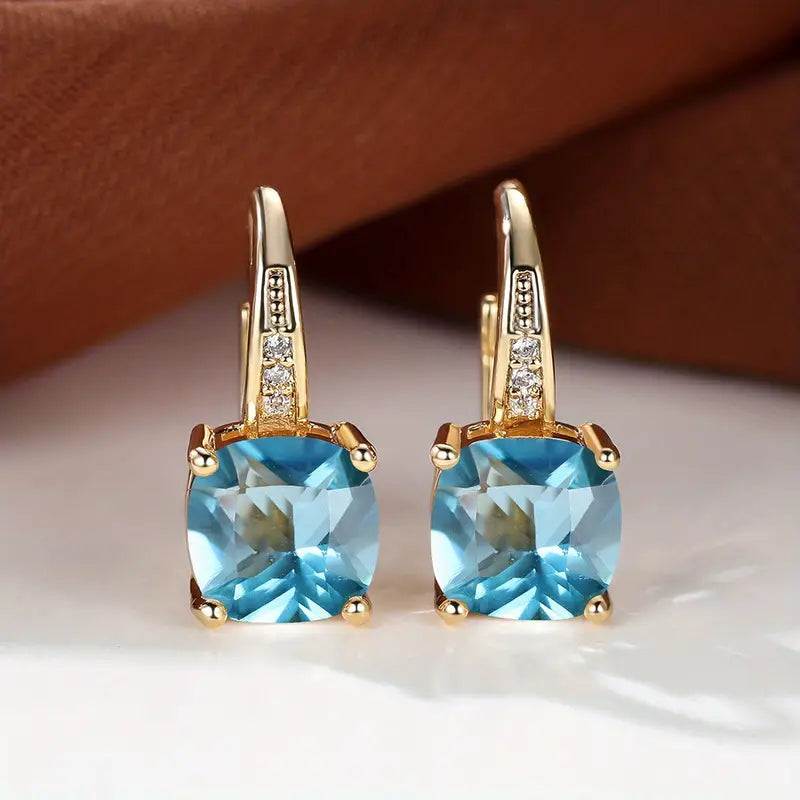 Złote kolczyki koła z kamieniem szlachetnym Mystic Sapphire