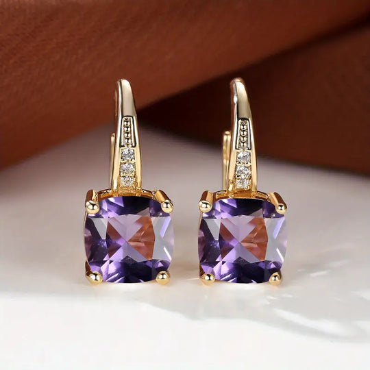 Złote kolczyki koła z kamieniem szlachetnym Mystic Sapphire