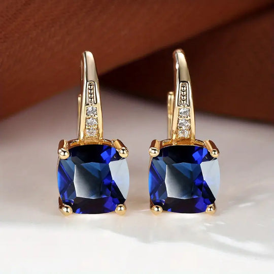Złote kolczyki koła z kamieniem szlachetnym Mystic Sapphire