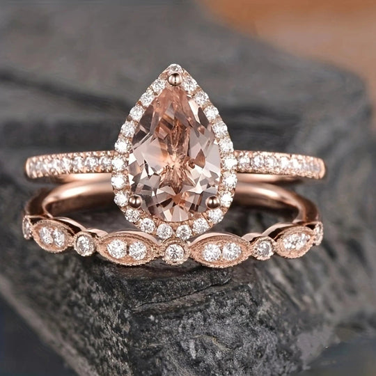 Zestaw różowych pierścionków z kroplą wody i różą