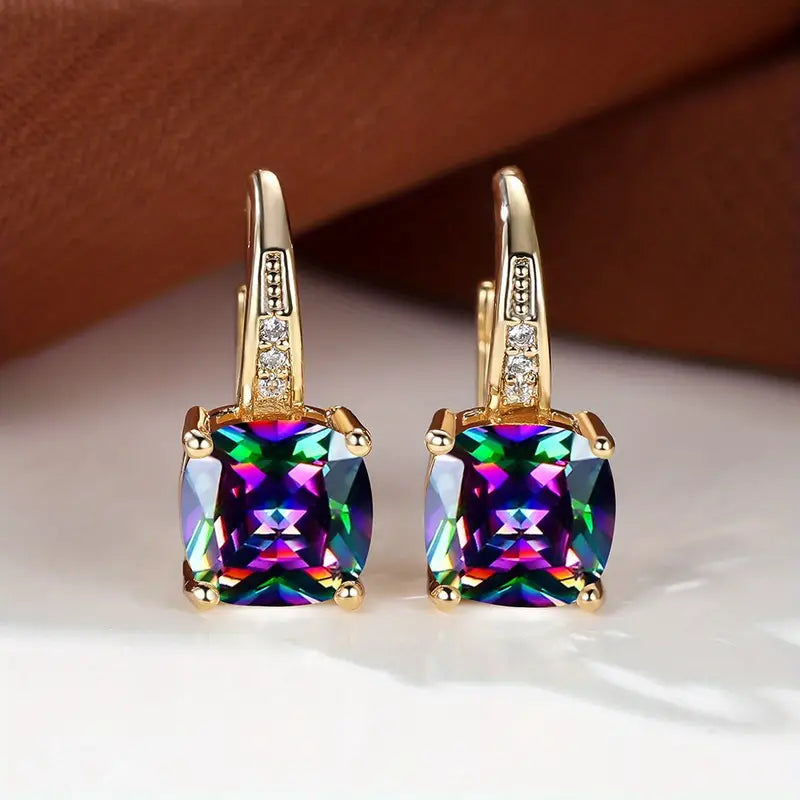 Złote kolczyki koła z kamieniem szlachetnym Mystic Sapphire