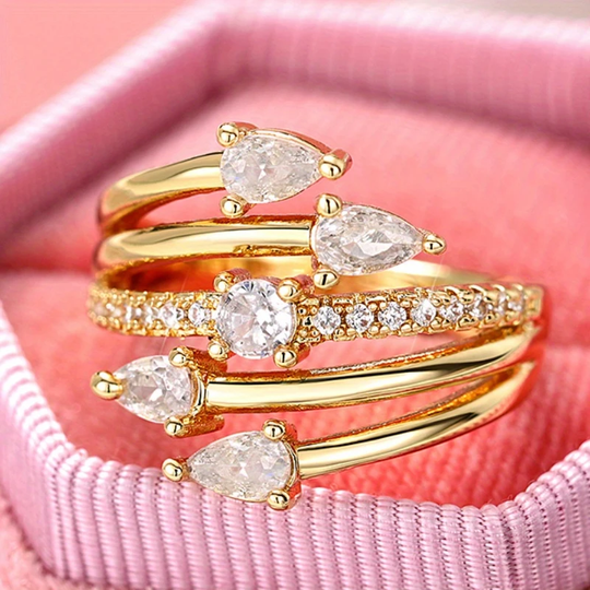 Warstwowy złoty pierścień z kryształowymi kroplami